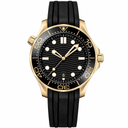 Sporty diver watch with black dial, gold-tone case, and black rubber strap