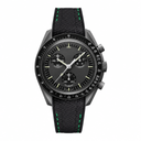 Chronograph watch with black dial and black rubber strap featuring green stitching