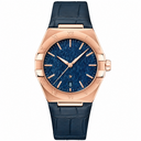 Men's dress watch with blue dial and rose gold tone case on blue leather strap