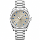 Elegant dress watch with silver case and bracelet, gray dial with blue markers, and embellished bezel